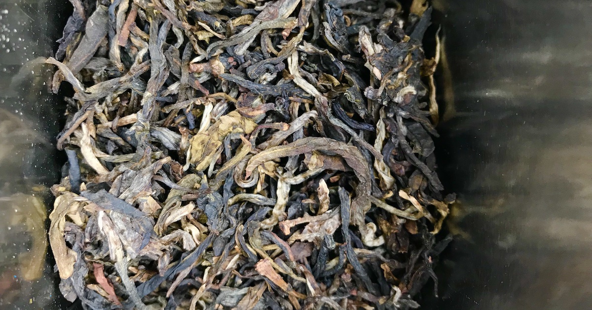 Pu Erh tea stored in a tin tea storage container